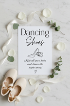 Dancing Shoes sign flat lay with ivory ballet pumps and rose petals