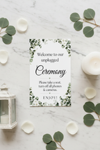 Greenery Unplugged Ceremony sign flat lay with eucalyptus and lantern on marble