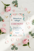 Pastel Floral Unplugged Ceremony sign flat lay with pink roses and teal eucalyptus
