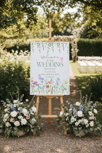 Wildflower wedding welcome print on easel at venue entrance